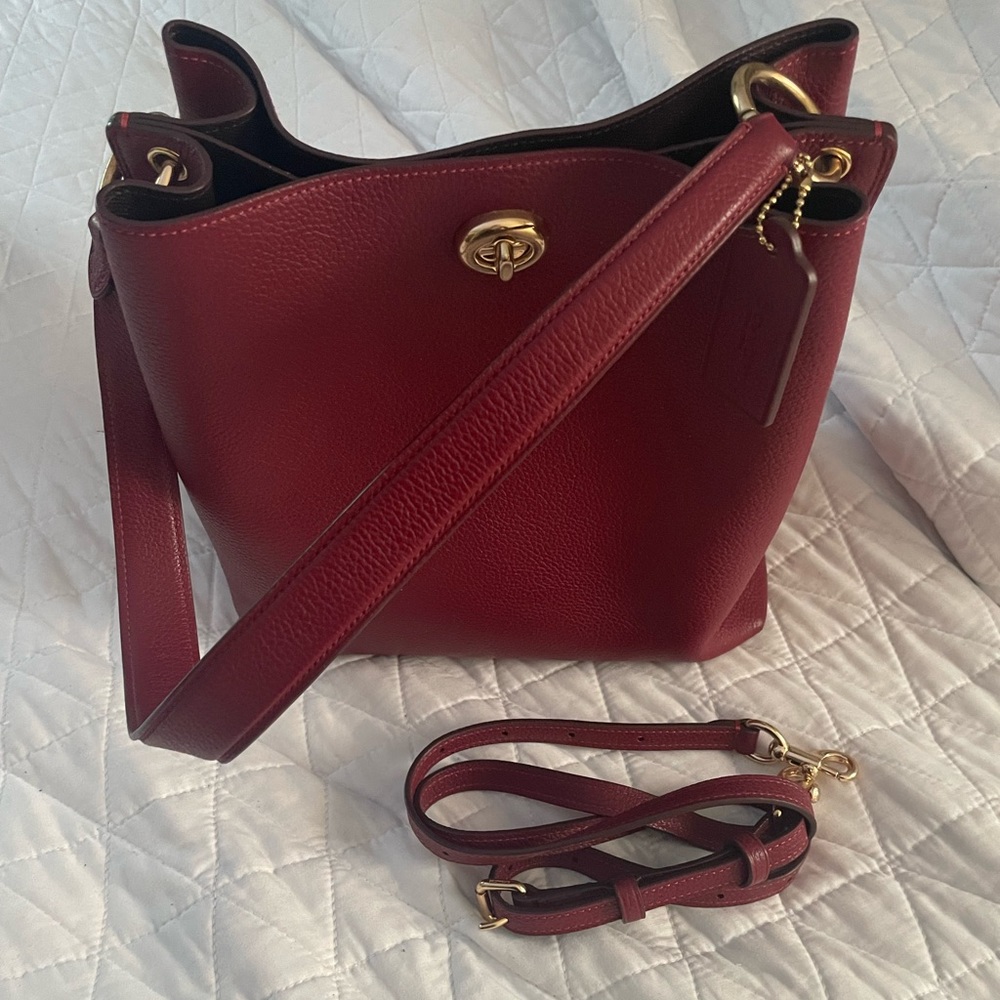 COPY - Coach Charlie bucket/crossbody bag in burgundy with brown lining.
